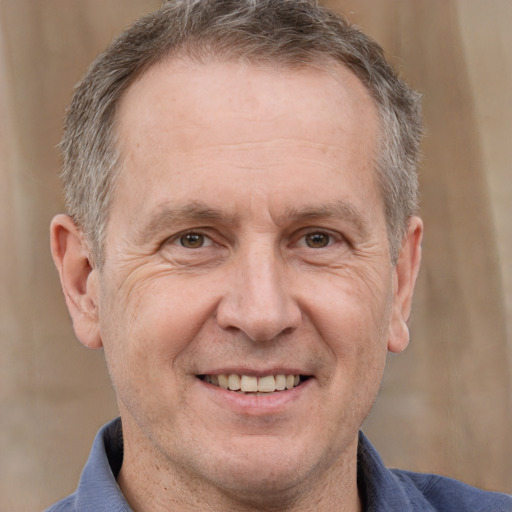 Joyful white middle-aged male with short  brown hair and brown eyes