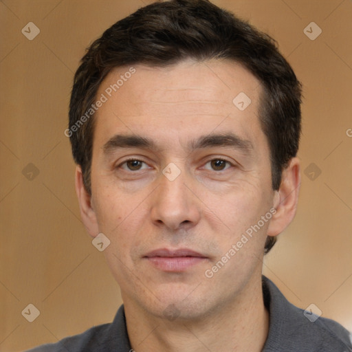 Joyful white adult male with short  brown hair and brown eyes