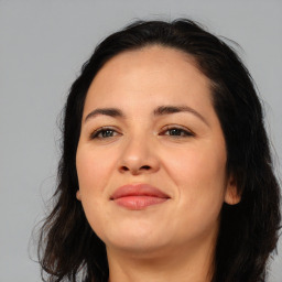 Joyful asian young-adult female with long  brown hair and brown eyes