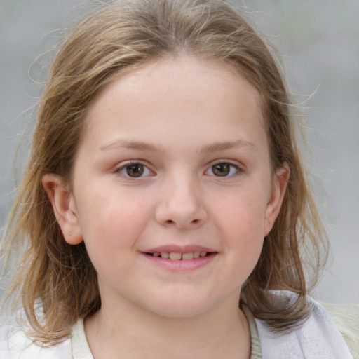 Joyful white child female with medium  brown hair and brown eyes