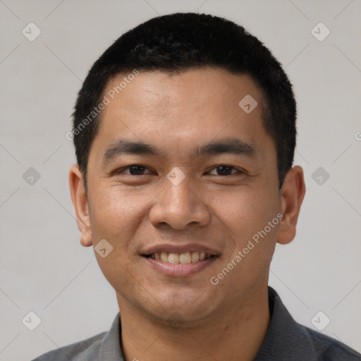 Joyful asian young-adult male with short  black hair and brown eyes