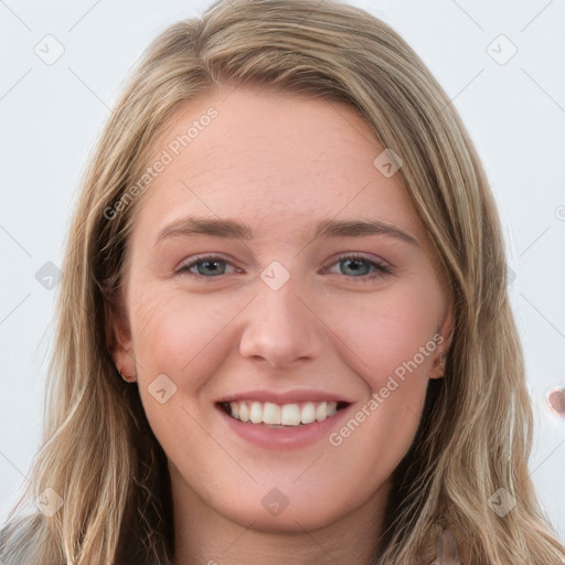 Joyful white young-adult female with long  brown hair and blue eyes