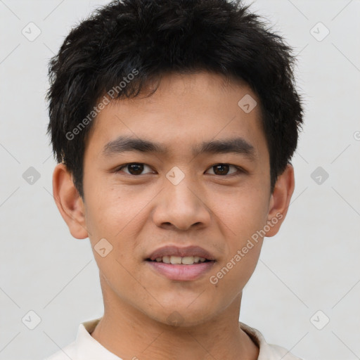 Joyful asian young-adult male with short  brown hair and brown eyes