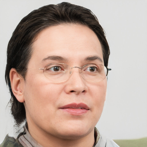 Joyful white adult male with medium  brown hair and brown eyes