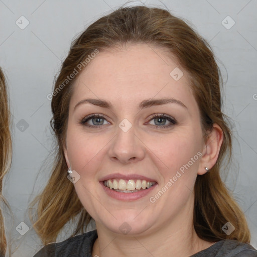 Joyful white young-adult female with medium  brown hair and blue eyes