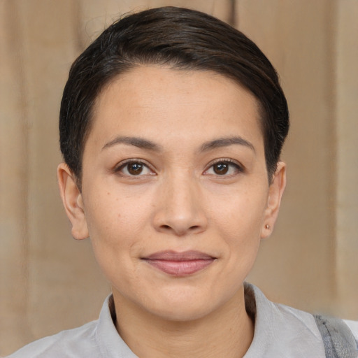 Joyful white young-adult female with medium  brown hair and brown eyes