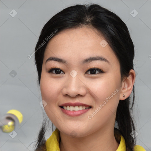 Joyful asian young-adult female with medium  black hair and brown eyes