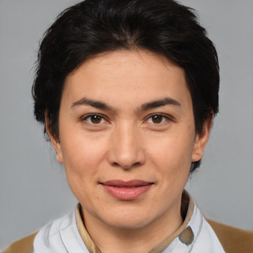 Joyful white adult female with medium  brown hair and brown eyes