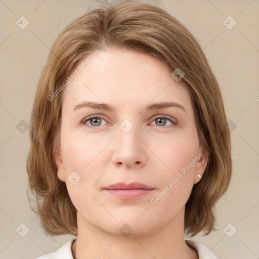 Joyful white young-adult female with medium  brown hair and green eyes