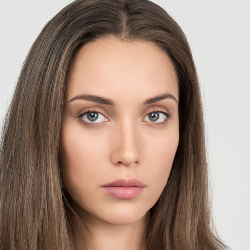 Neutral white young-adult female with long  brown hair and brown eyes