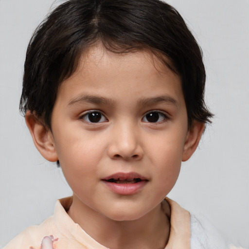 Joyful white child female with short  brown hair and brown eyes