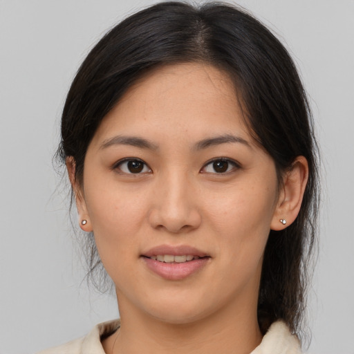 Joyful asian young-adult female with medium  brown hair and brown eyes