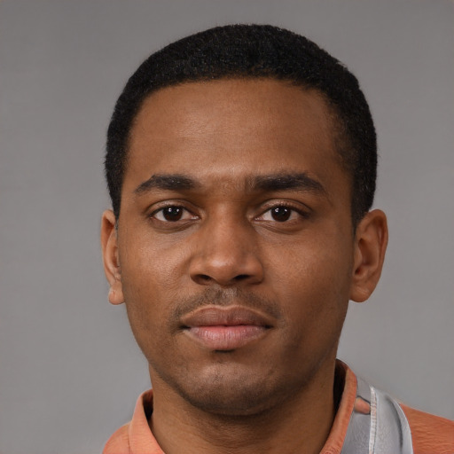 Neutral black young-adult male with short  black hair and brown eyes