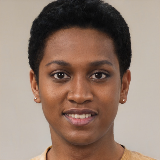 Joyful black young-adult female with short  black hair and brown eyes