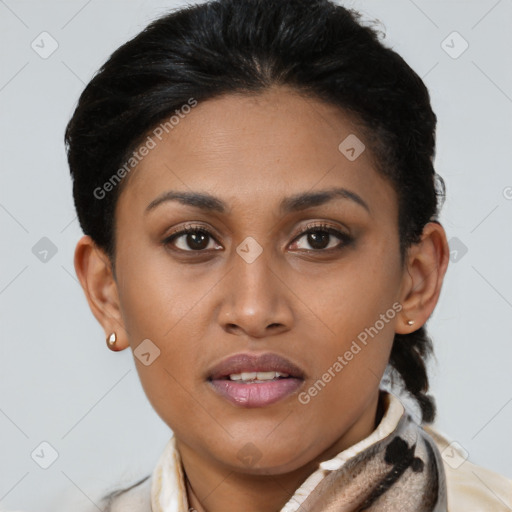 Joyful latino young-adult female with short  brown hair and brown eyes