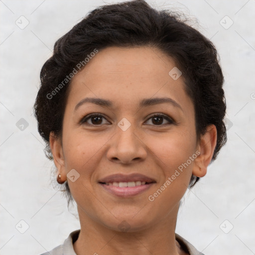 Joyful latino adult female with short  brown hair and brown eyes