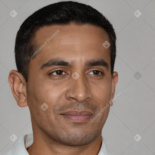 Joyful latino young-adult male with short  brown hair and brown eyes