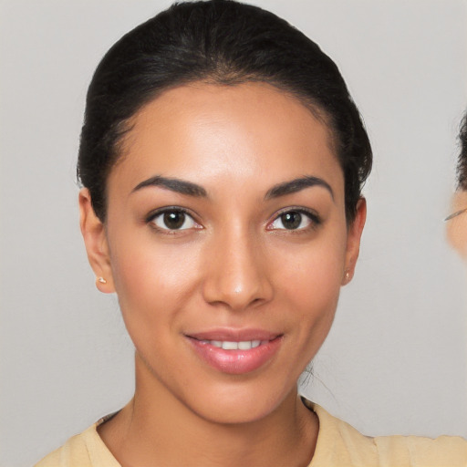 Joyful latino young-adult female with short  brown hair and brown eyes