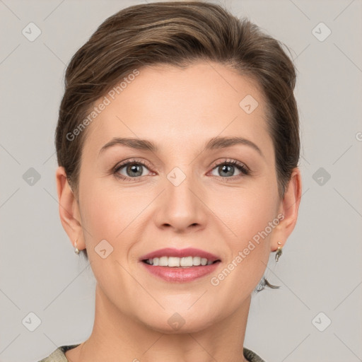 Joyful white young-adult female with short  brown hair and grey eyes