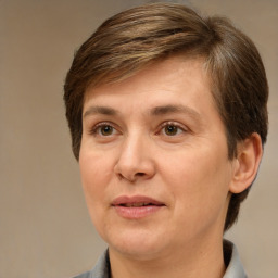 Joyful white adult female with short  brown hair and brown eyes