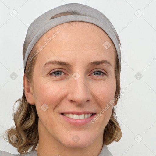 Joyful white young-adult female with medium  brown hair and blue eyes