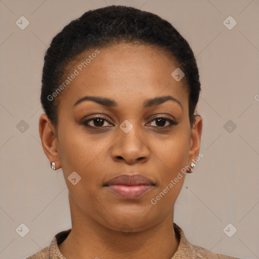 Joyful black young-adult female with short  black hair and brown eyes