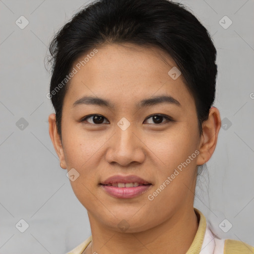 Joyful asian young-adult female with short  brown hair and brown eyes