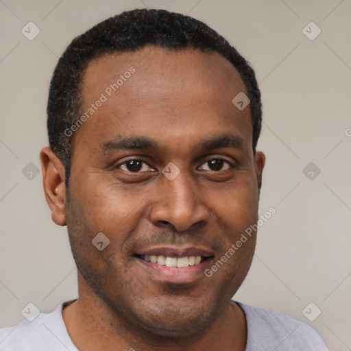 Joyful latino young-adult male with short  brown hair and brown eyes