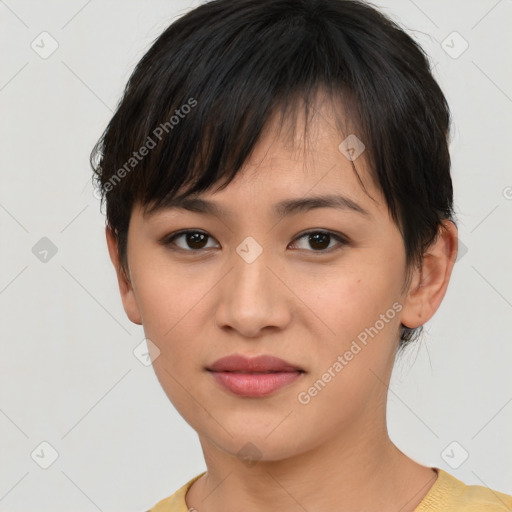 Joyful asian young-adult female with short  brown hair and brown eyes