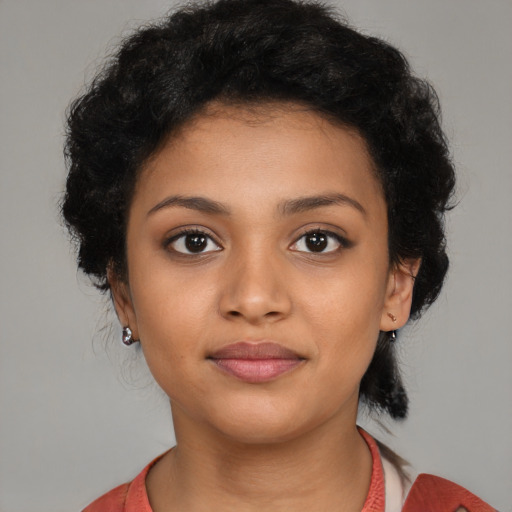 Joyful latino young-adult female with medium  black hair and brown eyes