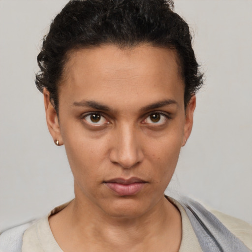 Neutral white young-adult female with short  brown hair and brown eyes