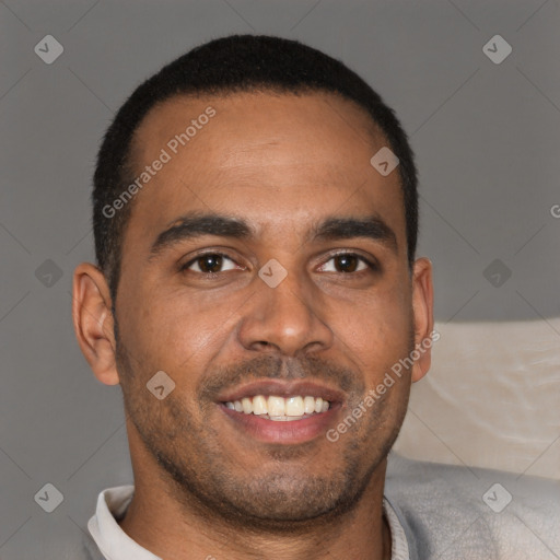 Joyful black young-adult male with short  brown hair and brown eyes