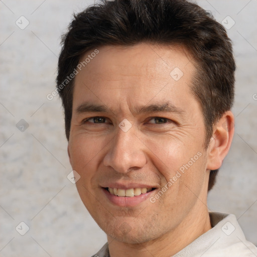 Joyful white adult male with short  brown hair and brown eyes