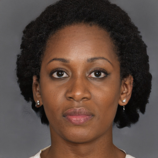 Neutral black young-adult female with short  brown hair and brown eyes
