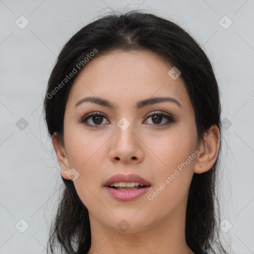 Joyful asian young-adult female with long  brown hair and brown eyes