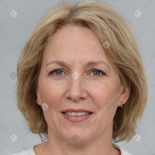 Joyful white adult female with medium  brown hair and blue eyes