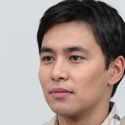 Neutral white young-adult male with short  black hair and brown eyes