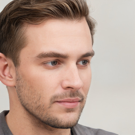 Neutral white young-adult male with short  brown hair and grey eyes