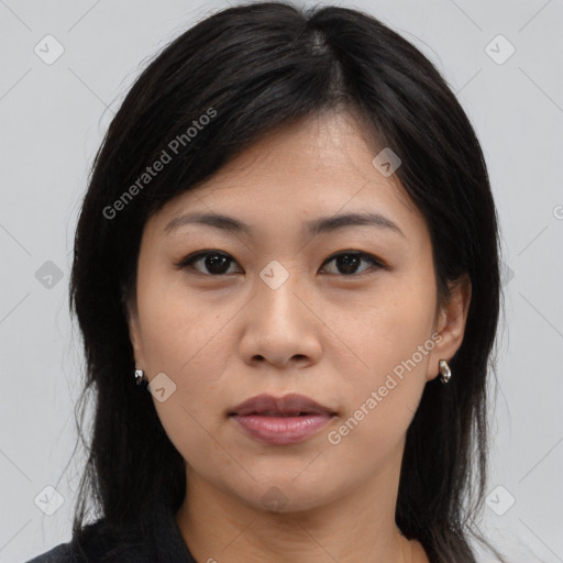 Joyful asian young-adult female with medium  brown hair and brown eyes