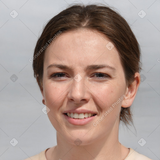 Joyful white young-adult female with medium  brown hair and grey eyes