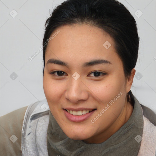 Joyful asian young-adult female with short  brown hair and brown eyes