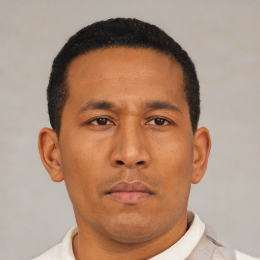 Neutral latino young-adult male with short  black hair and brown eyes