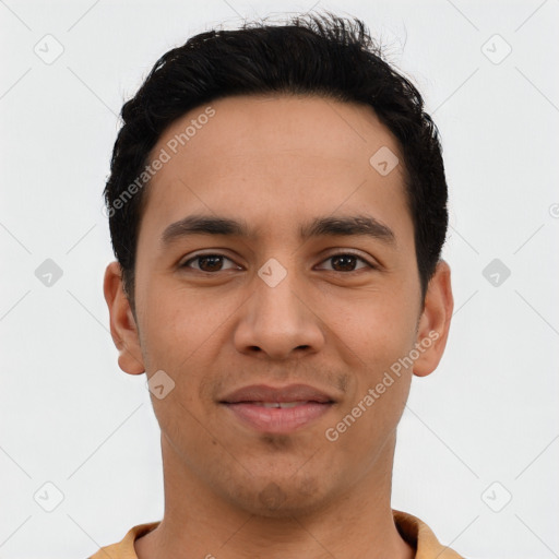 Joyful latino young-adult male with short  black hair and brown eyes