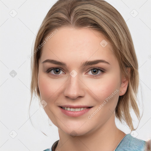 Joyful white young-adult female with medium  brown hair and blue eyes