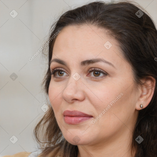 Joyful white adult female with medium  brown hair and brown eyes