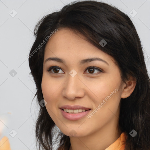 Joyful latino young-adult female with long  brown hair and brown eyes