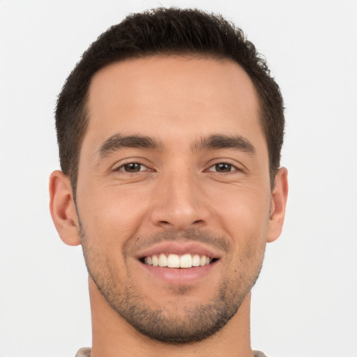 Joyful white young-adult male with short  brown hair and brown eyes