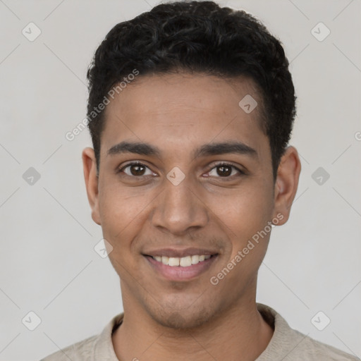 Joyful latino young-adult male with short  black hair and brown eyes