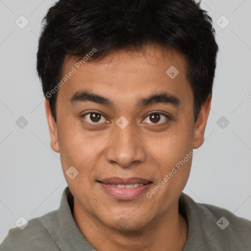 Joyful asian young-adult male with short  brown hair and brown eyes