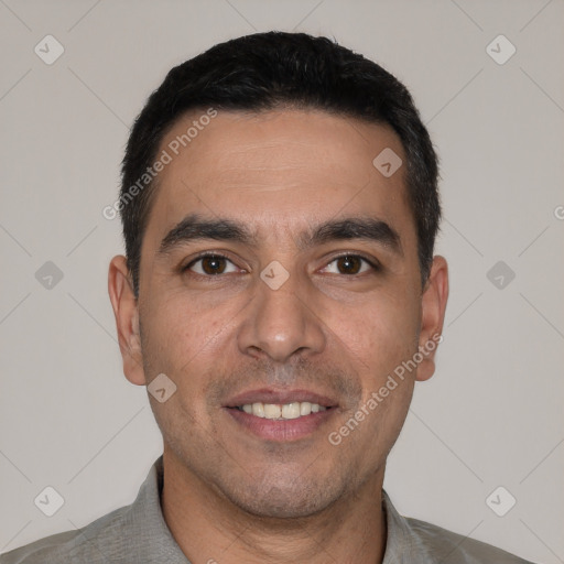 Joyful white young-adult male with short  black hair and brown eyes